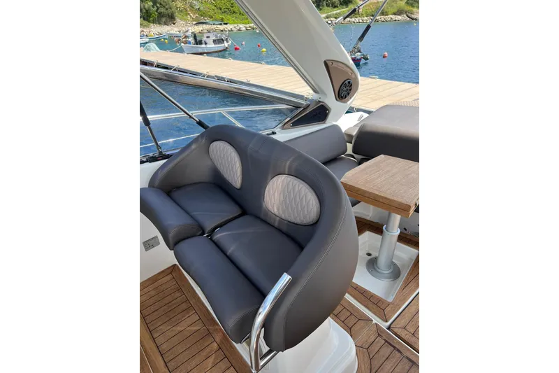  Yacht Photos Pics Luxury seating on 2009 Crachi Endurance 33 yacht, featuring elegant design and waterfront view.