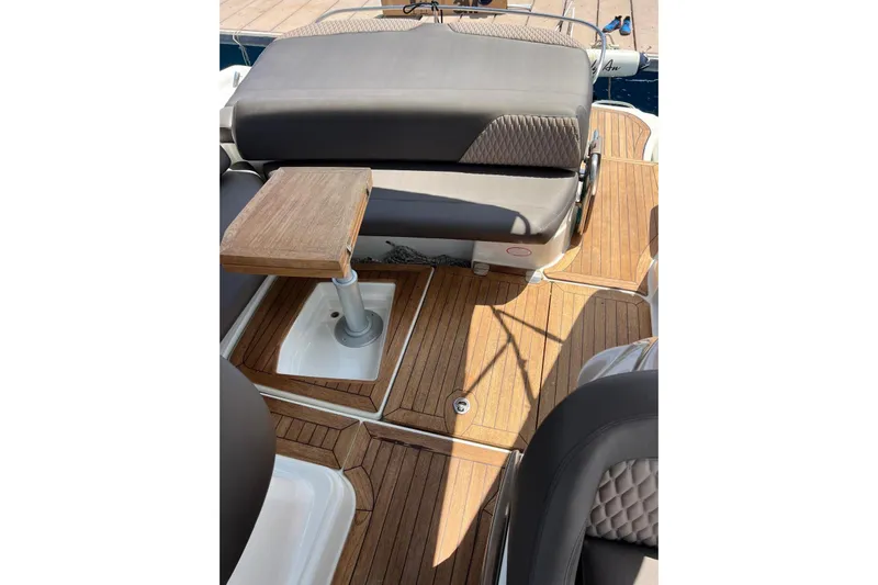  Yacht Photos Pics 2009 Crachi Endurance 33 boat interior with wooden deck and cushioned seating.