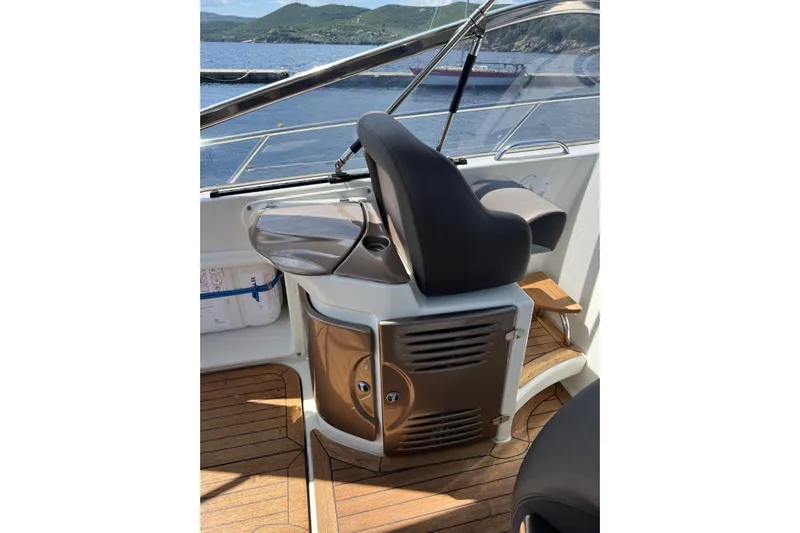  Yacht Photos Pics Interior of 2009 Crachi Endurance 33 boat with sleek helm and wooden flooring.