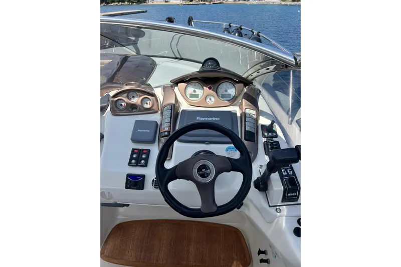  Yacht Photos Pics Cockpit of 2009 Crachi Endurance 33 boat with steering wheel and navigation controls.