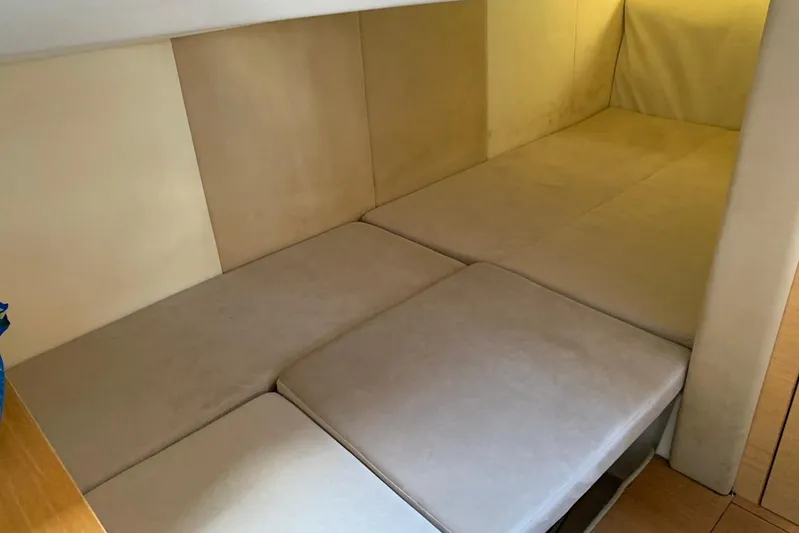  Yacht Photos Pics Interior cabin of 2009 Crachi Endurance 33 with beige cushions and walls.