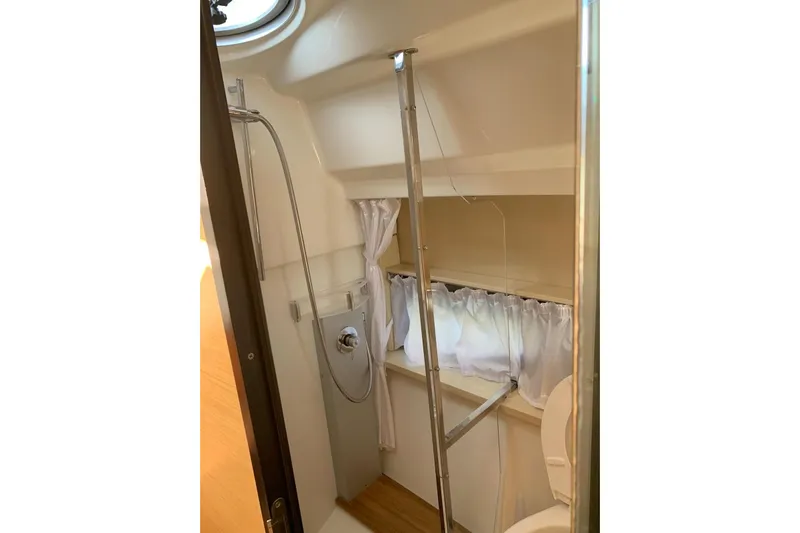  Yacht Photos Pics Compact bathroom in 2009 Crachi Endurance 33 boat with shower and window.