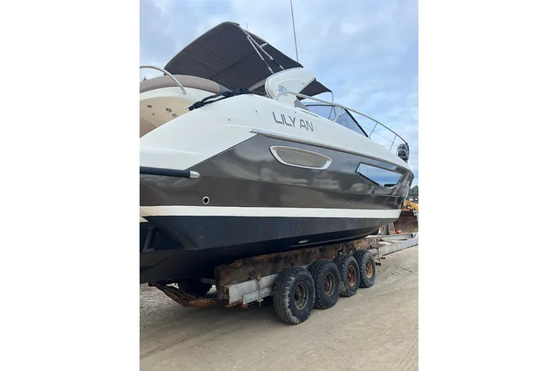  Yacht Photos Pics 2009 Crachi Endurance 33 boat on trailer, side view, outdoors.
