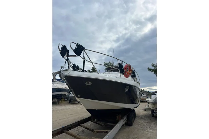  Yacht Photos Pics 2009 Crachi Endurance 33 boat on trailer under cloudy sky.