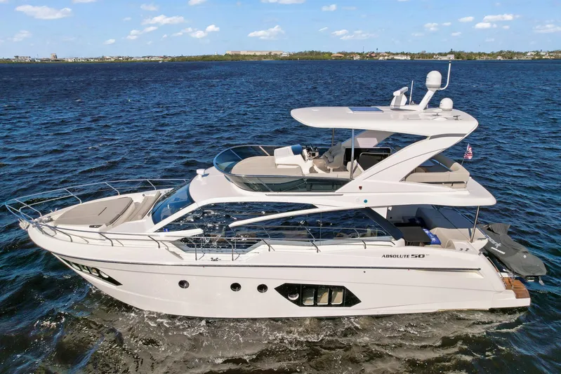  Yacht Photos Pics 2019 Absolute 50 Fly yacht cruising on open water under a clear blue sky.