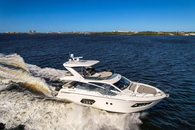  Yacht Photos Pics 2019 Absolute 50 Fly yacht cruising on open water under clear blue sky.