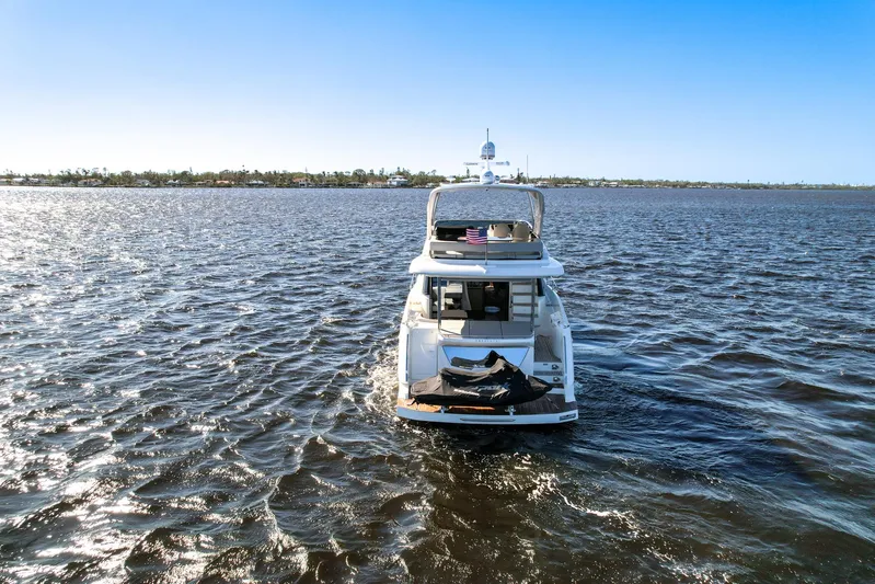  Yacht Photos Pics 2019 Absolute 50 Fly yacht cruising on open water under clear blue sky.