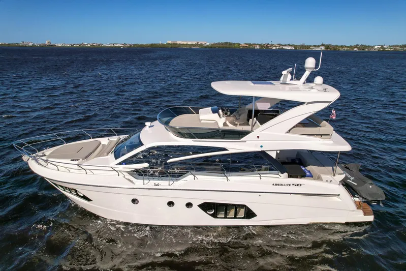  Yacht Photos Pics 2019 Absolute 50 Fly yacht cruising on open water under clear blue skies.