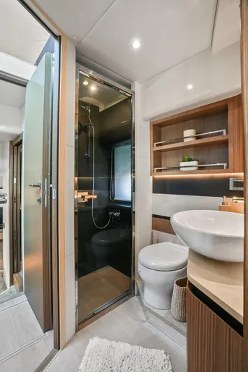  Yacht Photos Pics Luxurious bathroom in 2019 Absolute 50 Fly yacht, featuring modern fixtures and elegant design.