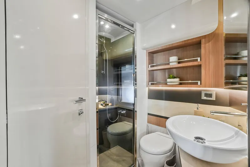  Yacht Photos Pics Luxurious bathroom interior of 2019 Absolute 50 Fly yacht with modern fixtures and elegant design.