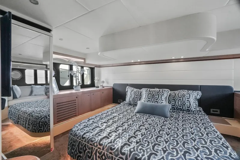  Yacht Photos Pics Luxurious bedroom interior of 2019 Absolute 50 Fly yacht with patterned bedding and modern design.