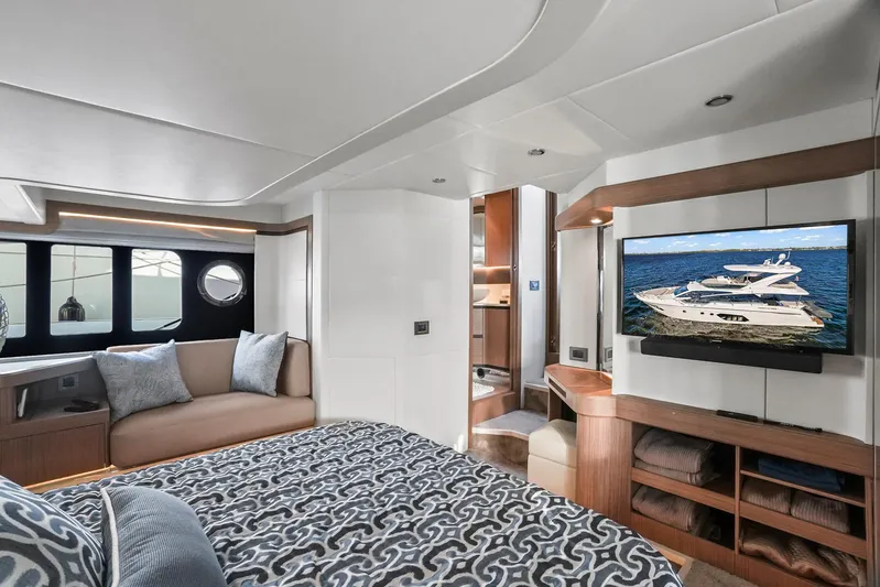  Yacht Photos Pics Luxurious interior of 2019 Absolute 50 Fly yacht with modern decor and large TV.