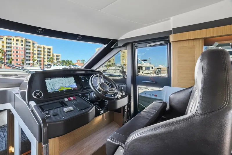 Yacht Photos Pics Interior view of 2019 Absolute 50 Fly yacht cockpit with modern navigation system.