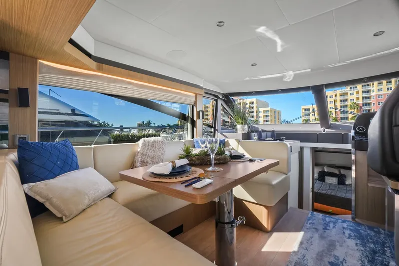  Yacht Photos Pics Luxurious interior of 2019 Absolute 50 Fly yacht with elegant dining area.