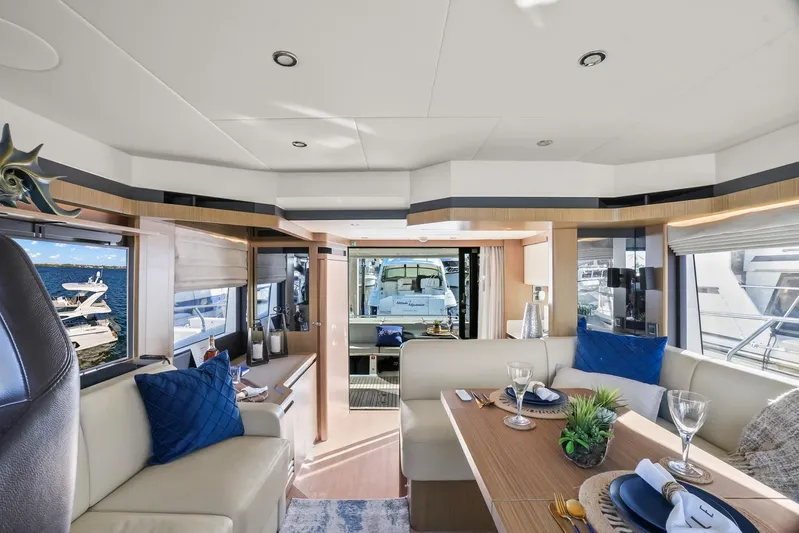  Yacht Photos Pics Luxurious interior of 2019 Absolute 50 Fly yacht with elegant dining area and scenic views.