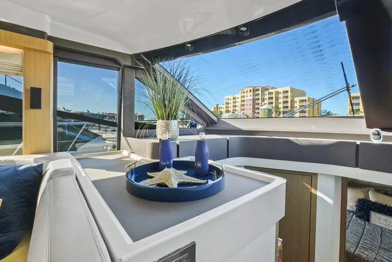  Yacht Photos Pics Luxurious interior of 2019 Absolute 50 Fly yacht with elegant decor and cityscape view.