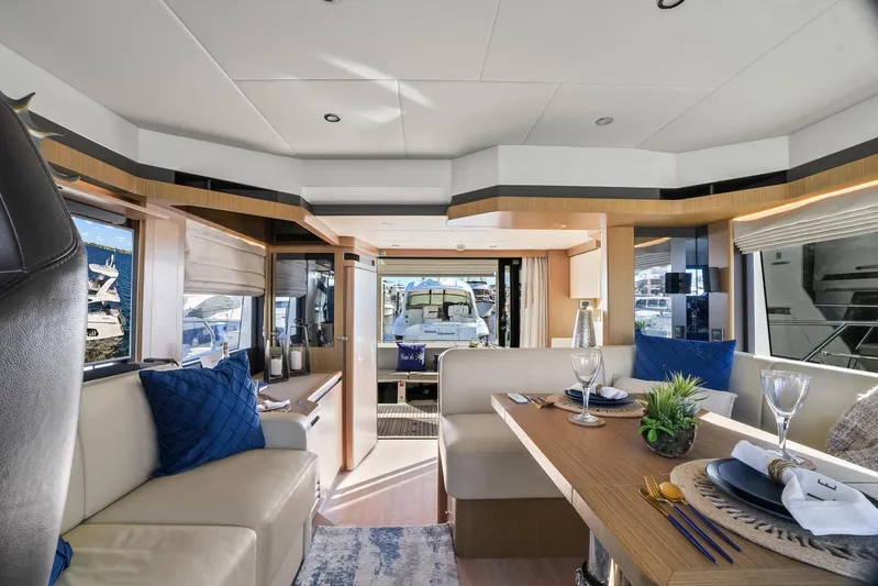 Yacht Photos Pics Luxurious interior of a 2019 Absolute 50 Fly yacht with elegant dining area.