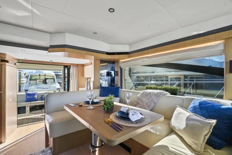  Yacht Photos Pics Luxurious interior of 2019 Absolute 50 Fly yacht with elegant dining area.