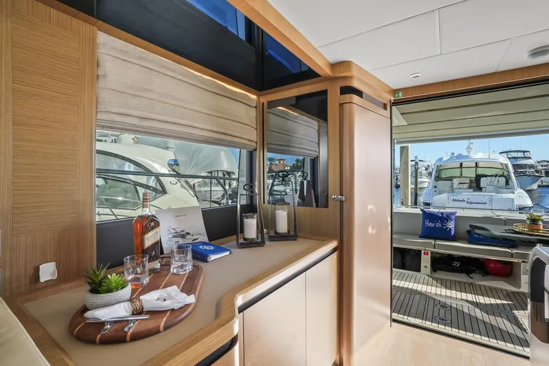  Yacht Photos Pics Luxurious interior of 2019 Absolute 50 Fly yacht with marina view.