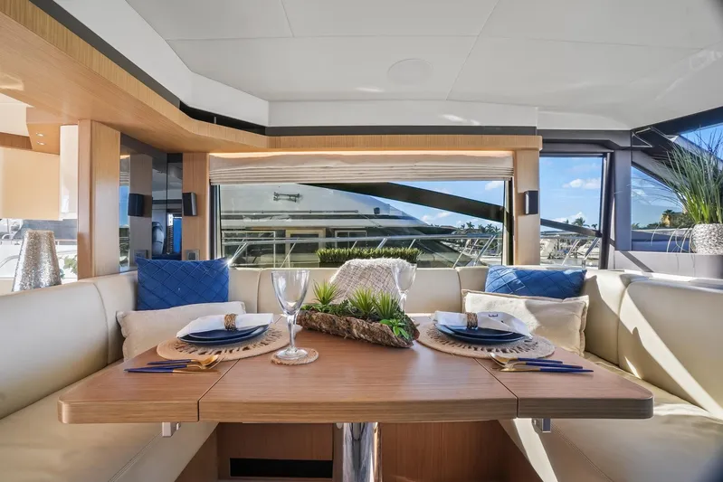  Yacht Photos Pics Luxurious dining area on 2019 Absolute 50 Fly yacht with elegant table setting.
