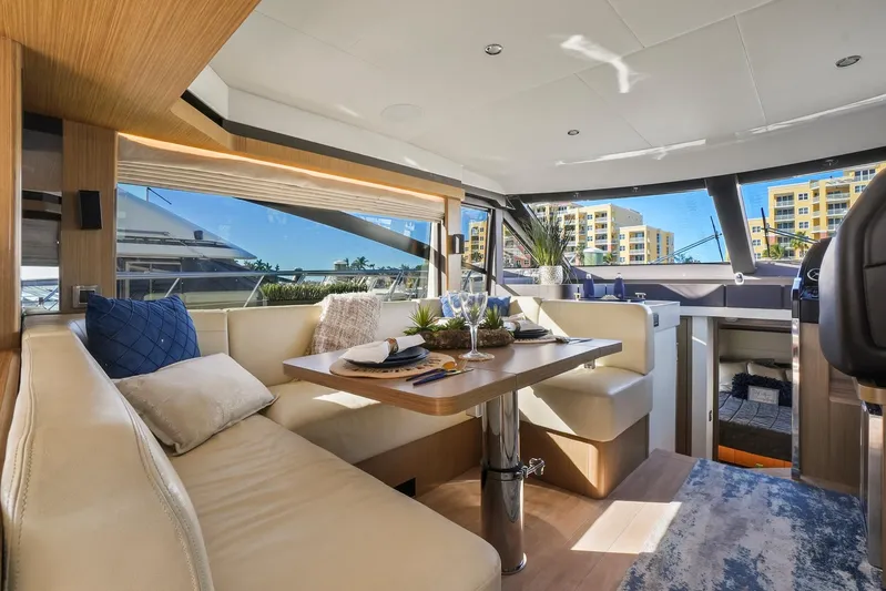  Yacht Photos Pics Luxurious interior of 2019 Absolute 50 Fly yacht with elegant seating and dining area.