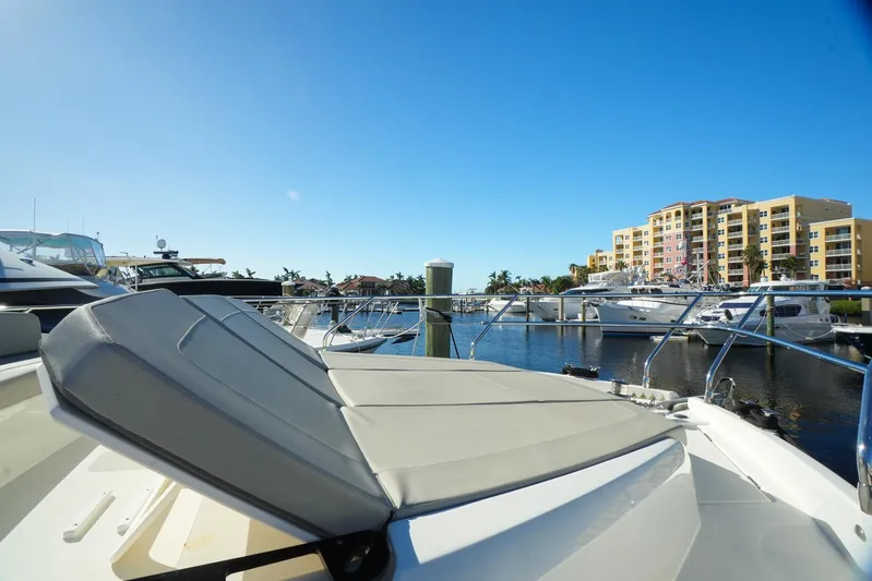  Yacht Photos Pics 2019 Absolute 50 Fly yacht docked in sunny marina with clear blue sky.