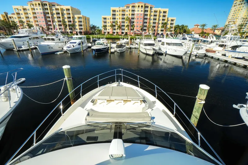  Yacht Photos Pics Luxury Absolute 50 Fly yacht docked in marina, 2019 model, with waterfront buildings in background.