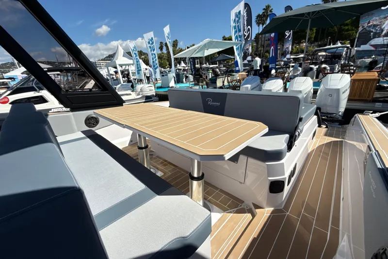  Yacht Photos Pics 2026 Ranieri CAYMAN 50.0 HARD TOP yacht interior with sleek seating and table design.