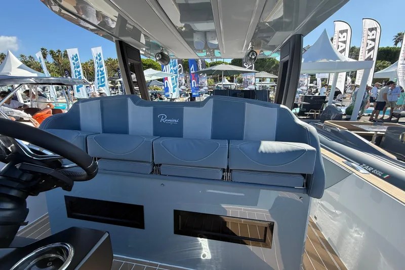  Yacht Photos Pics 2026 Ranieri CAYMAN 50.0 HARD TOP interior at a boat show, showcasing luxury seating.