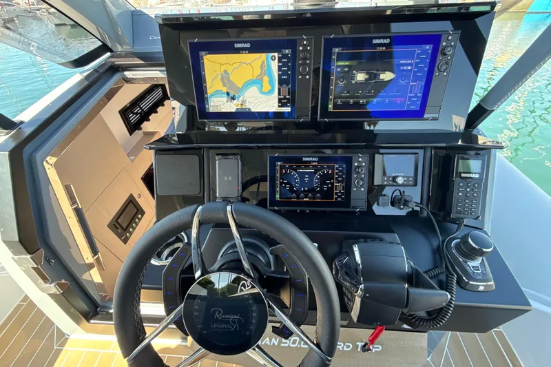  Yacht Photos Pics Control panel of 2026 Ranieri CAYMAN 50.0 HARD TOP with advanced navigation displays.
