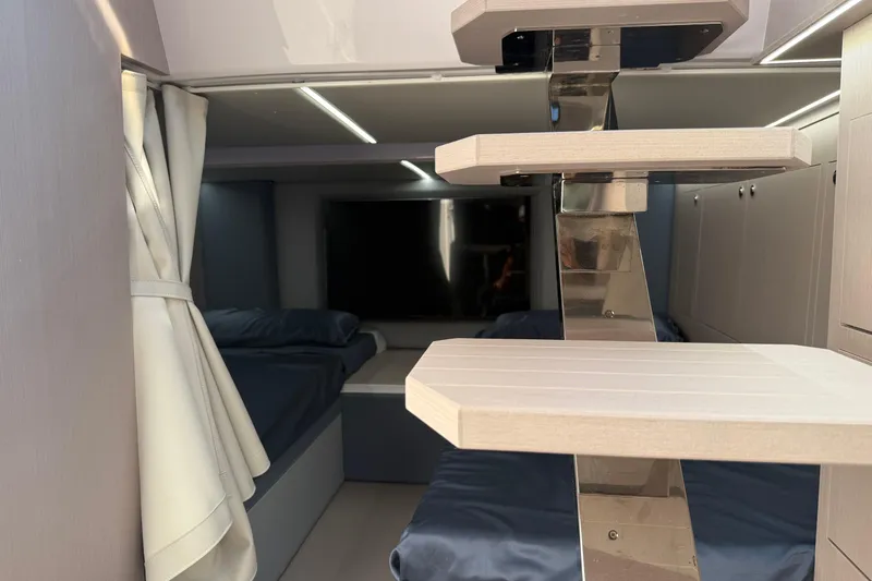  Yacht Photos Pics Interior of 2026 Ranieri CAYMAN 50.0 HARD TOP yacht with modern design and cozy sleeping area.