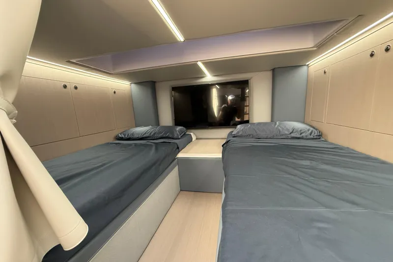  Yacht Photos Pics Interior cabin of 2026 Ranieri CAYMAN 50.0 HARD TOP with twin beds and modern design.