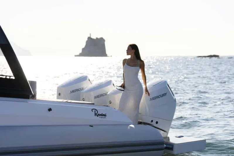  Yacht Photos Pics Woman on Ranieri CAYMAN 50.0 HARD TOP boat, ocean backdrop, 2026 model.