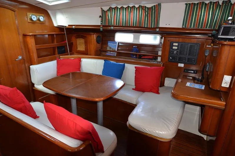  Yacht Photos Pics Interior of 1997 Beneteau Oceanis 461 yacht with cozy seating and colorful cushions.