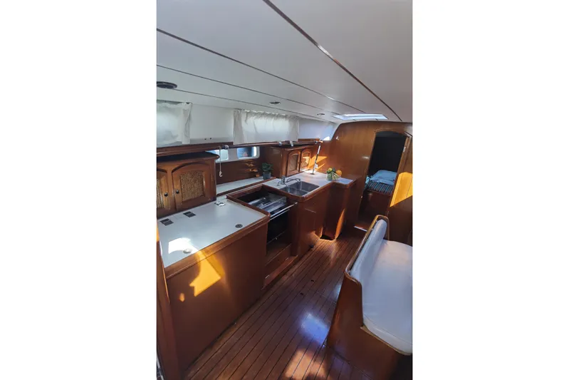  Yacht Photos Pics Interior of 1997 Beneteau Oceanis 461 yacht with wooden cabinetry and modern amenities.