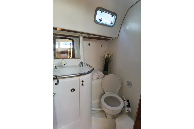 Yacht Photos Pics Bathroom interior of 1997 Beneteau Oceanis 461 yacht, featuring sink and toilet.