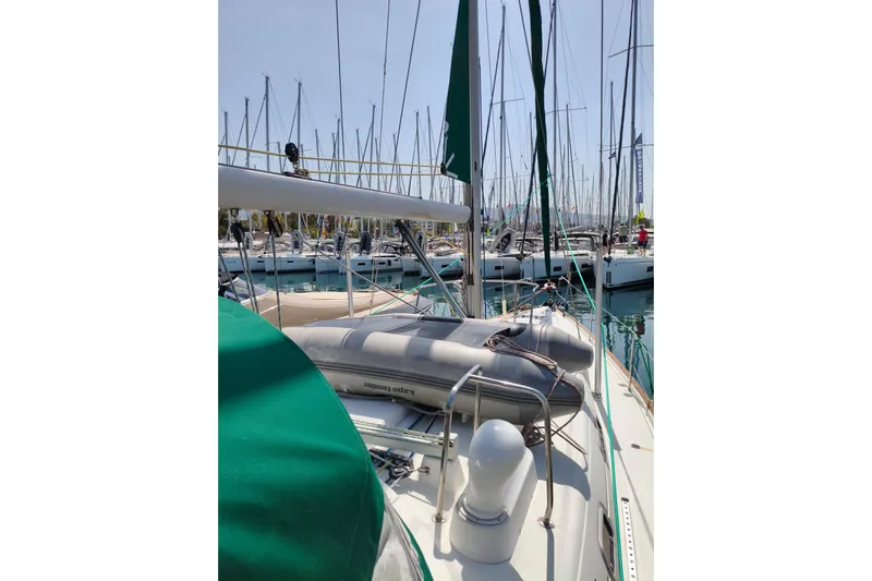  Yacht Photos Pics 1997 Beneteau Oceanis 461 sailboat docked in a marina, surrounded by other yachts.