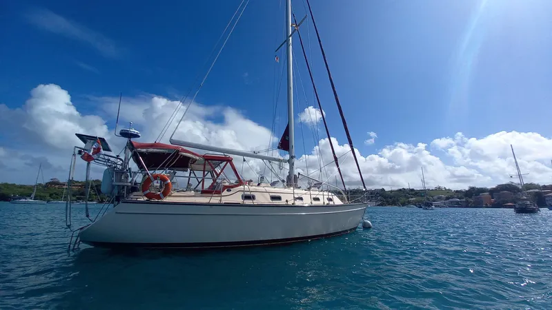 Sunny Girl Yacht Photos Pics Island Packet 370 sailboat from 2004 anchored in sunny, scenic waters.