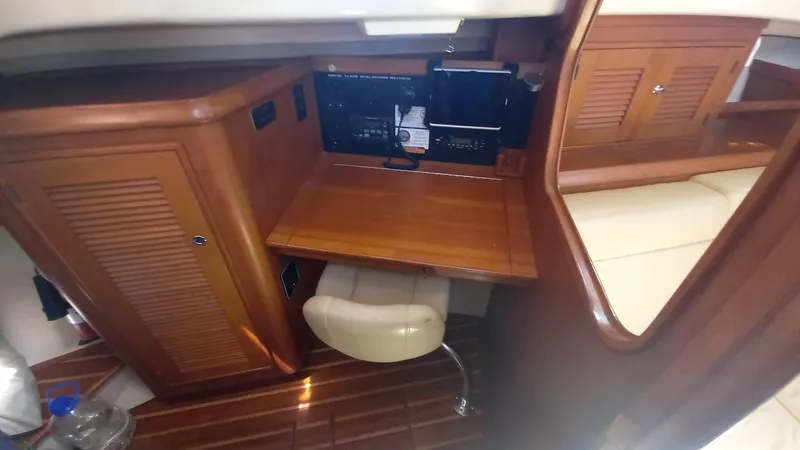 Sunny Girl Yacht Photos Pics 2004 Island Packet 370 yacht interior with wooden desk and chair.