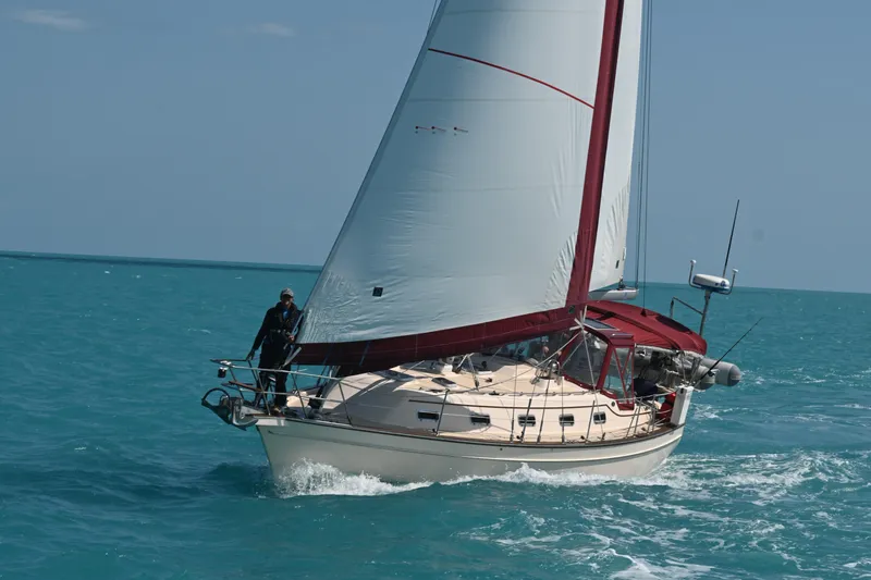 Sunny Girl Yacht Photos Pics Sailing yacht Island Packet 370, 2004 model, cruising on turquoise waters.