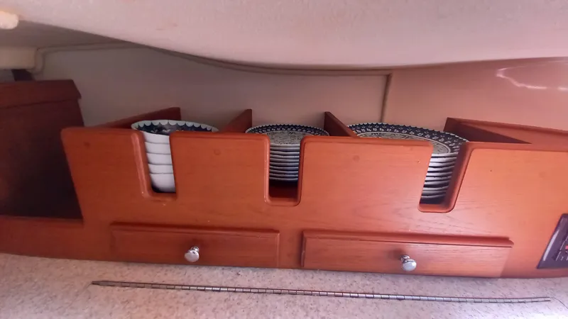 Sunny Girl Yacht Photos Pics Wooden dish rack with plates on Island Packet 370 sailboat, 2004 model.