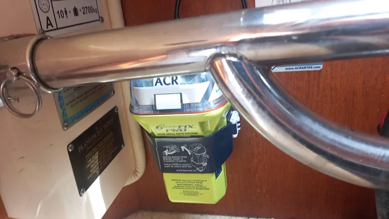 Sunny Girl Yacht Photos Pics EPIRB device on 2004 Island Packet 370 sailboat, secured with metal railing.