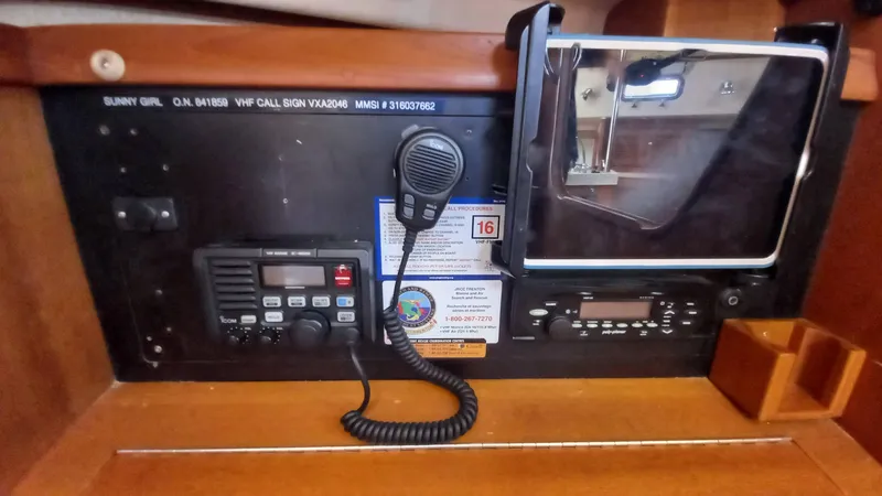 Sunny Girl Yacht Photos Pics Control panel of a 2004 Island Packet 370 sailboat with communication equipment.