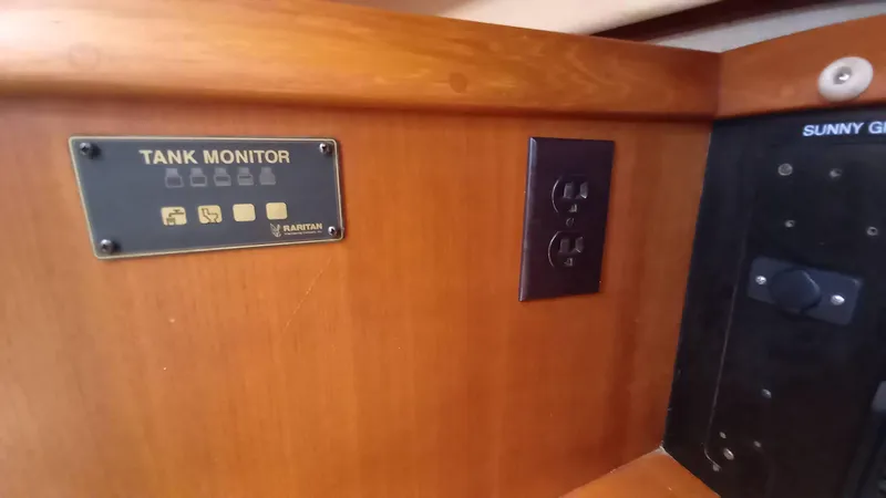 Sunny Girl Yacht Photos Pics Tank monitor and outlet on 2004 Island Packet 370 yacht interior.