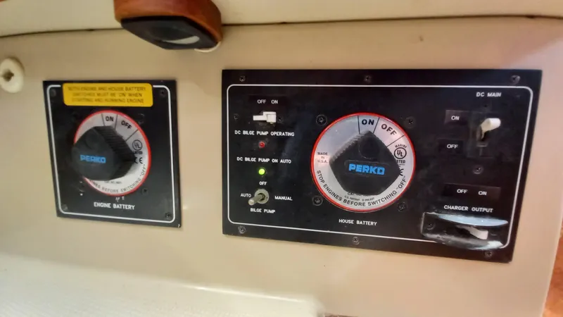 Sunny Girl Yacht Photos Pics Control panel of a 2004 Island Packet 370 sailboat, featuring Perko battery switches.