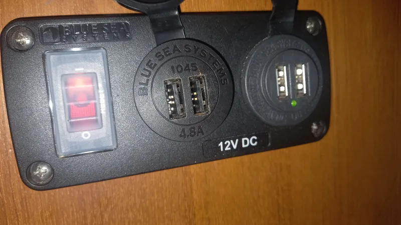 Sunny Girl Yacht Photos Pics 12V DC power panel with USB ports on Island Packet 370, 2004 model.