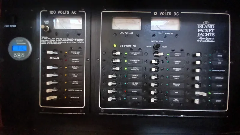 Sunny Girl Yacht Photos Pics Electrical panel of a 2004 Island Packet 370 yacht, showing 120V AC and 12V DC systems.