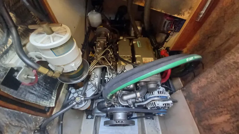 Sunny Girl Yacht Photos Pics Engine compartment of a 2004 Island Packet 370 sailboat, showcasing mechanical components and systems.