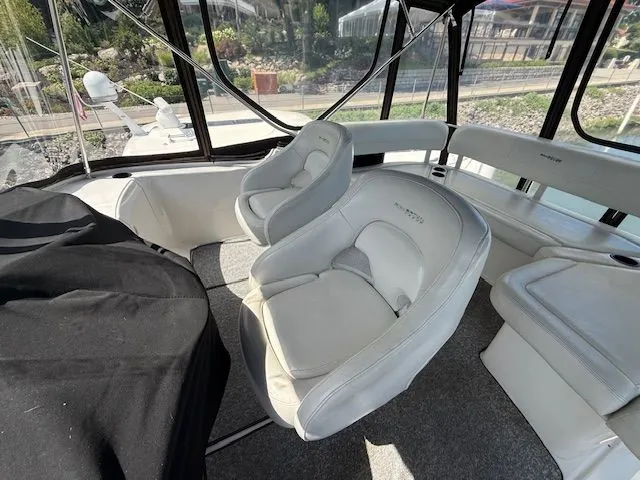  Yacht Photos Pics 2004 Silverton 34 Convertible boat interior with white seating and panoramic windows.