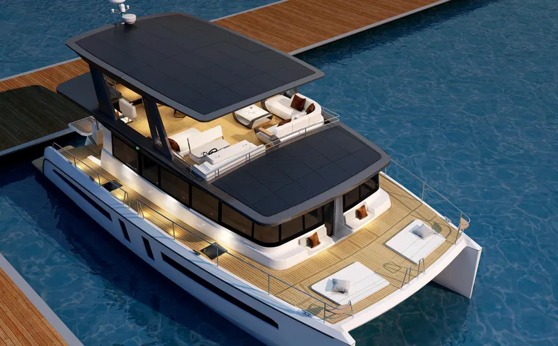  Yacht Photos Pics Luxurious 2025 Mazarin 55 Catamaran with hybrid electric technology, docked in serene waters.